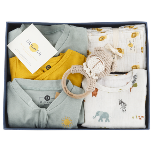 Image of a gift box filled with cute children toddler and baby clothes toys and newborn essentials Organic cotton organic muslin premium gift luxury gift sustainable clothes baby clothes baby gift newborn gift birthday gift onesie bodysuit